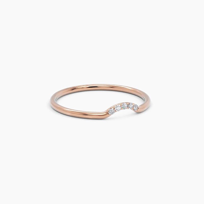 rose gold curved diamond ring in 14k rose gold, showcasing a warm-hued band with five sparkling diamonds set along a soft, curved silhouette
